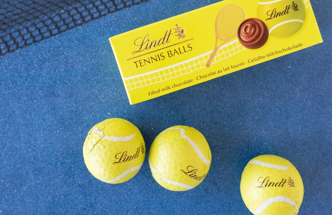 Lindt milk chocolate tennis balls in a three-pack tube packaging for the Australian Open event.