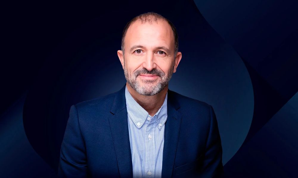 Jesus 'Chus' Bueno, the newly appointed CEO of Euroleague Basketball and former NBA executive, smiling in a professional setting.