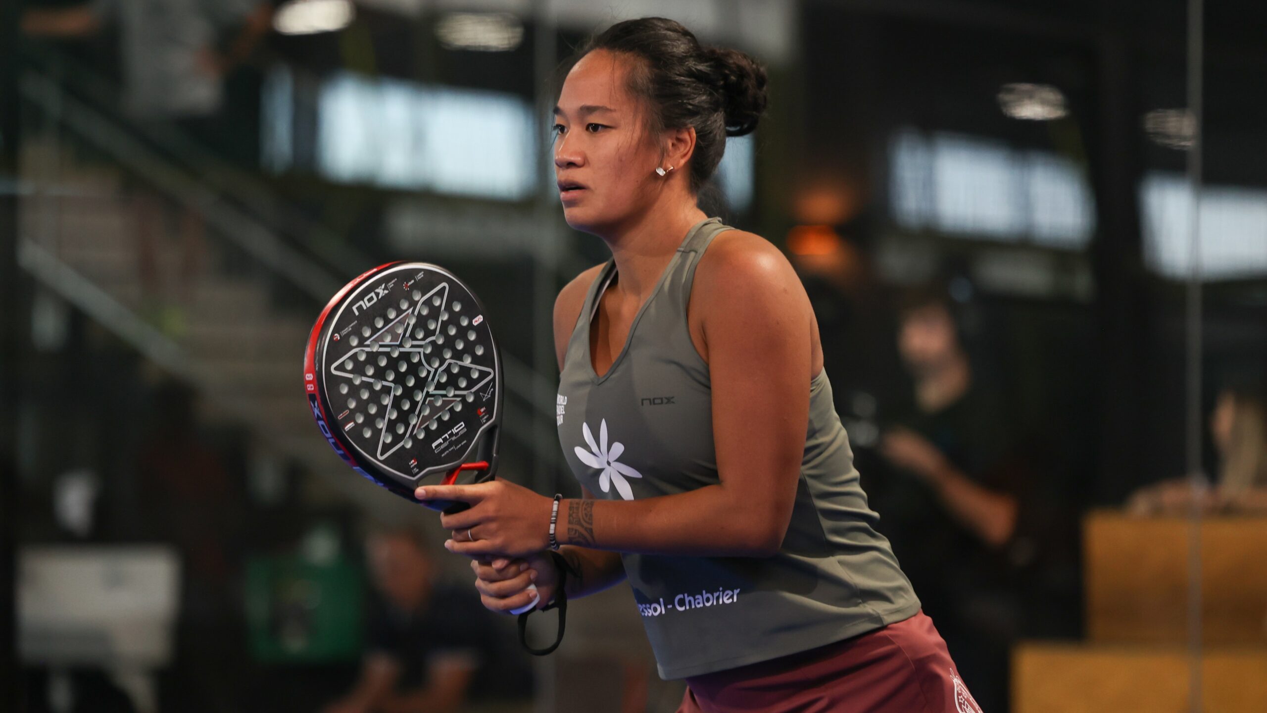 LÃ©a Godallier wearing a Certina DS-7 watch during a padel match.