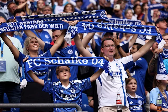 Exterior view of the VELTINS-Arena in Gelsenkirchen with the Schalke 04 logo.