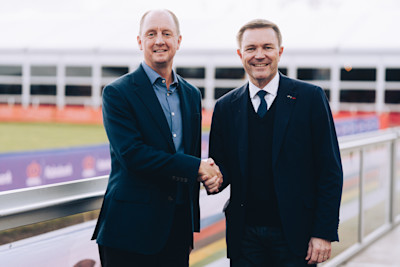 The UCI logo alongside professional cycling event logistics equipment, representing the new partnership with CSE.