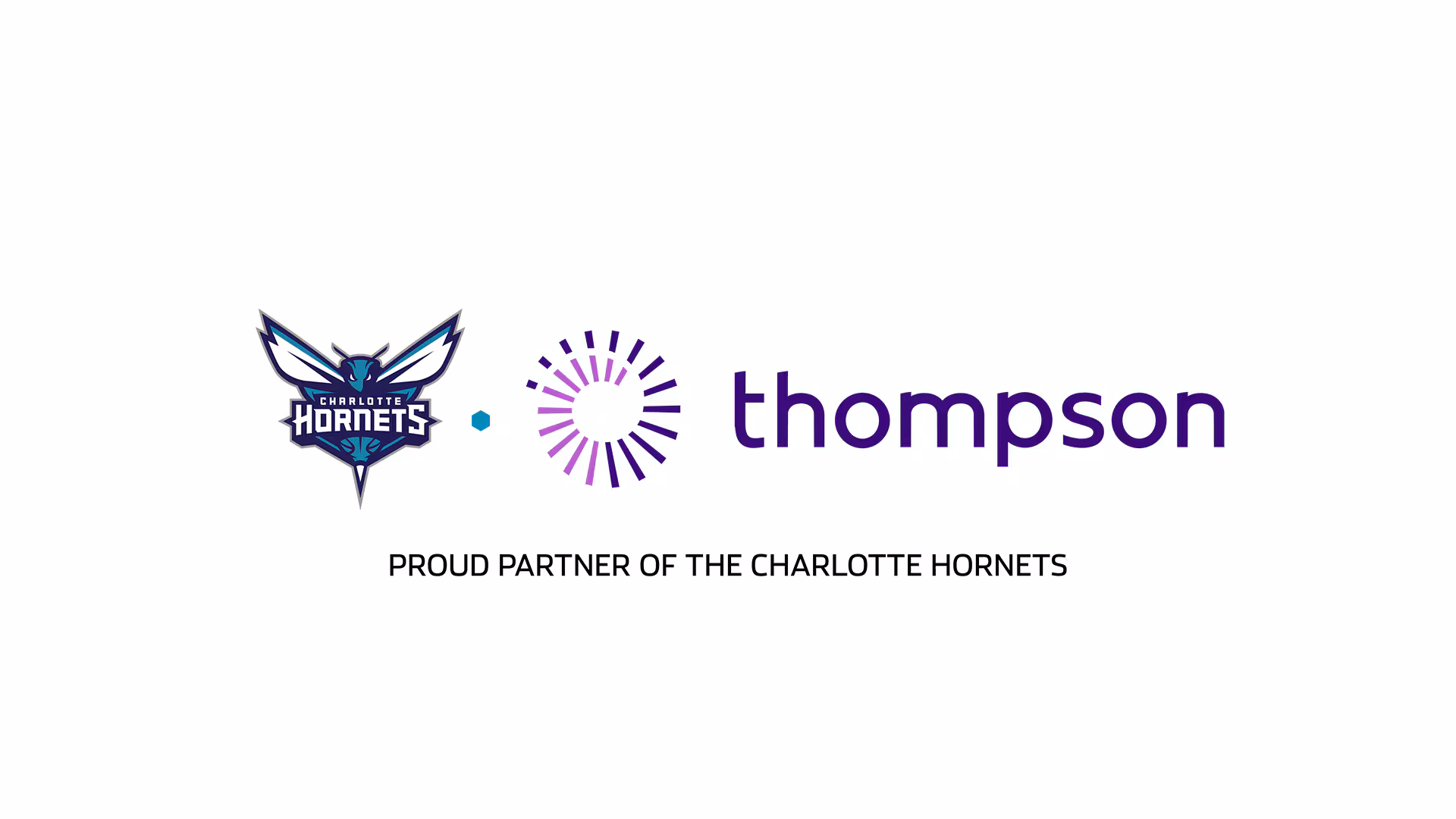 Charlotte Hornets and Thompson Child & Family Focus logos displayed at a community basketball clinic.