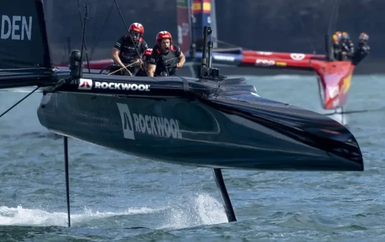 Danish SailGP F50 catamaran racing in Perth; American Magic logo with Nicolai Sehested; Technical wingmast repairs at the Pensacola facility.