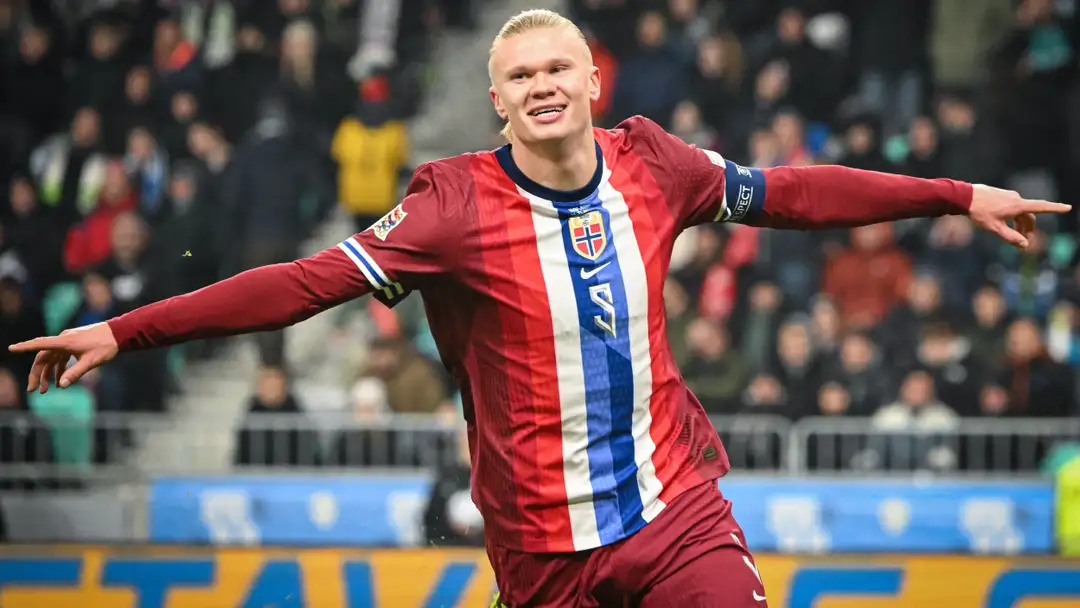 Norway national football team players Erling Haaland and Martin Odegaard celebrating during a 2026 FIFA World Cup qualifying match.