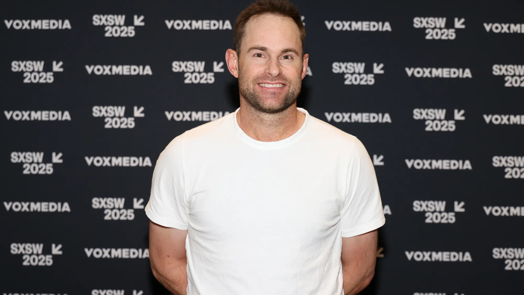 Andy Roddick speaking at a tennis event, now confirmed as ESPN's newest lead tennis analyst for 2026.