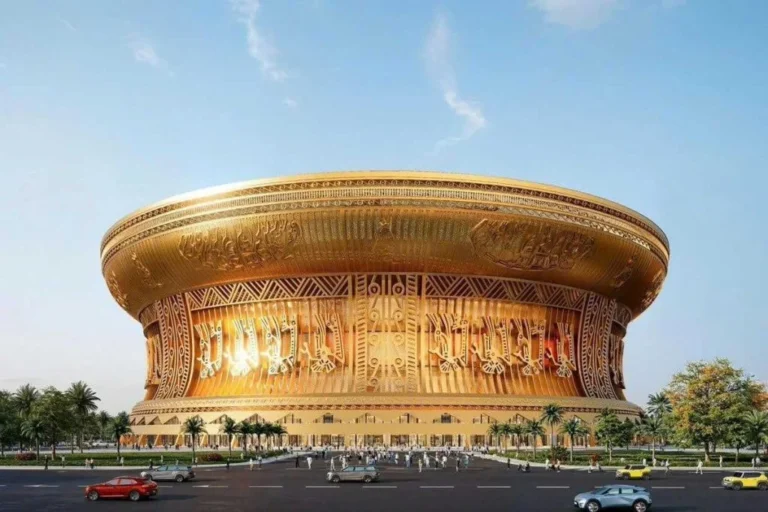 Architectural 3D render of the Trong Dong Stadium in Hanoi, Vietnam, featuring a circular golden drum-shaped design and retractable roof.