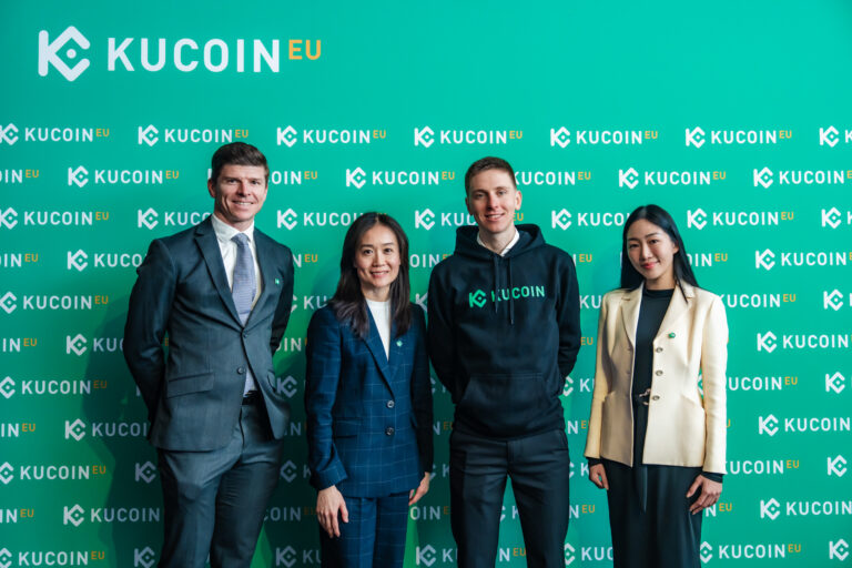 Tadej PogaÄar and KuCoin logo during the partnership announcement in Vienna