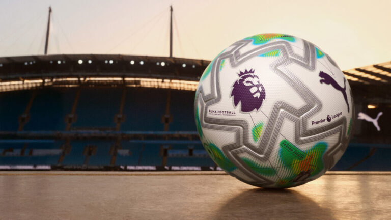 The PUMA Orbita Ultimate PL Thrill match ball with white base and orange-neon heatmap graphics.