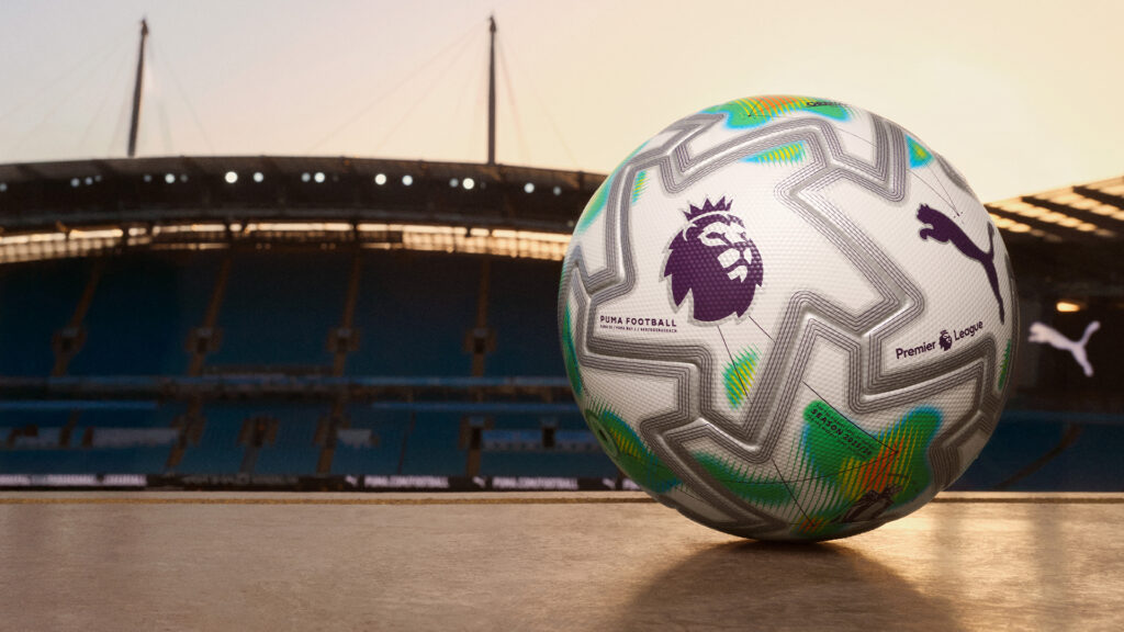 The PUMA Orbita Ultimate PL Thrill match ball with white base and orange-neon heatmap graphics.