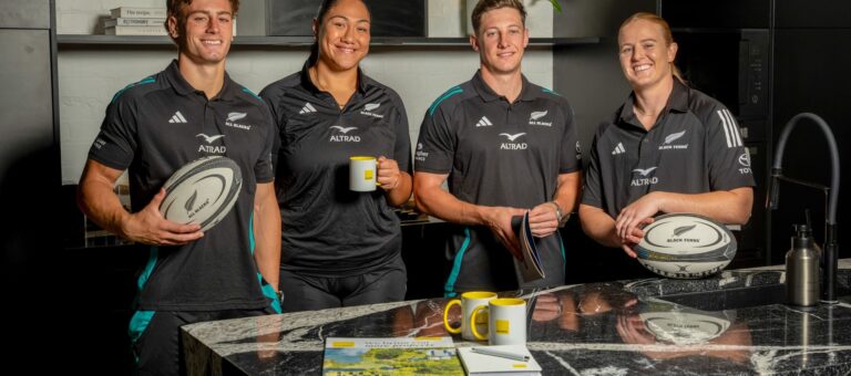 Ray White CEO Daniel Coulson and NZR Interim CEO Steve Lancaster with the All Blacks and Black Ferns jerseys.