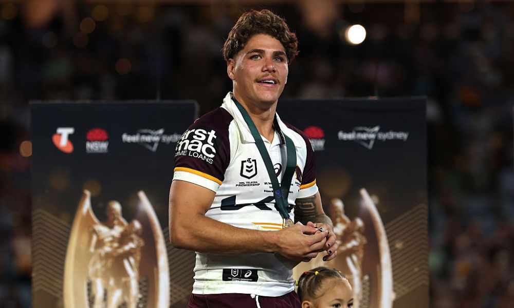 NRL fans celebrating at a sold-out stadium during the 2025 Grand Final, reflecting the league's record-breaking financial year.