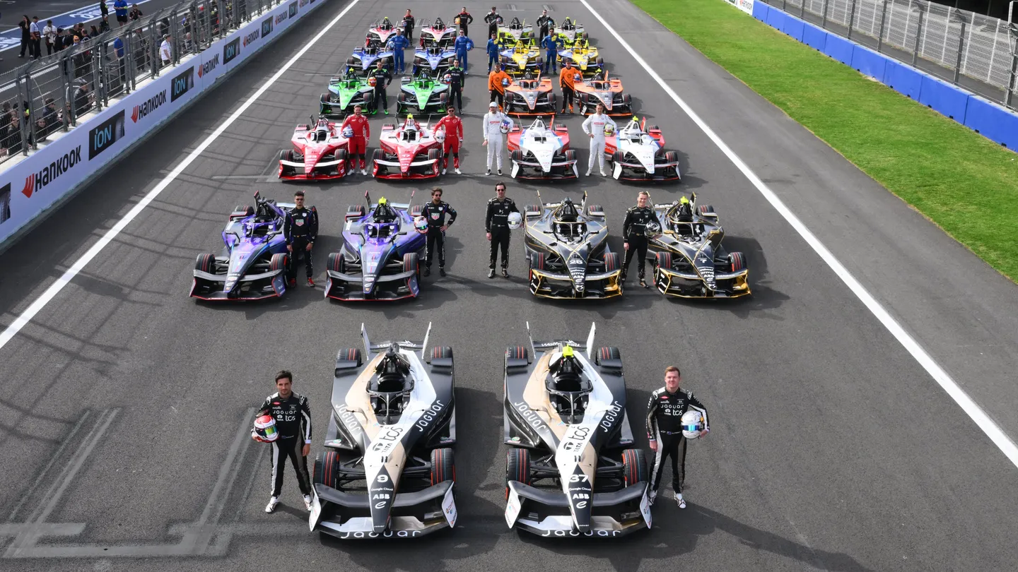 Formula E car racing under the lights at the TDK Tokyo E-Prix night event.
