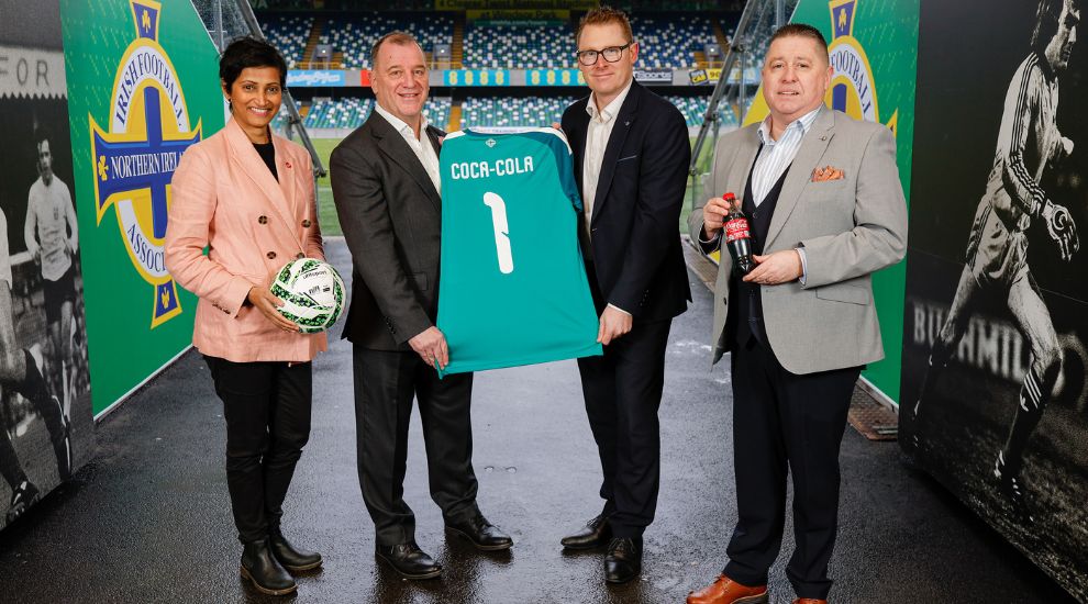 Coca-Cola and Northern Ireland Football League logos side-by-side representing the new sponsorship deal.