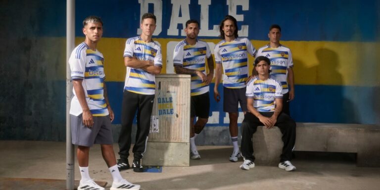 The 2026 Boca Juniors third jersey by Adidas, featuring white fabric with artistic blue and gold flag designs.