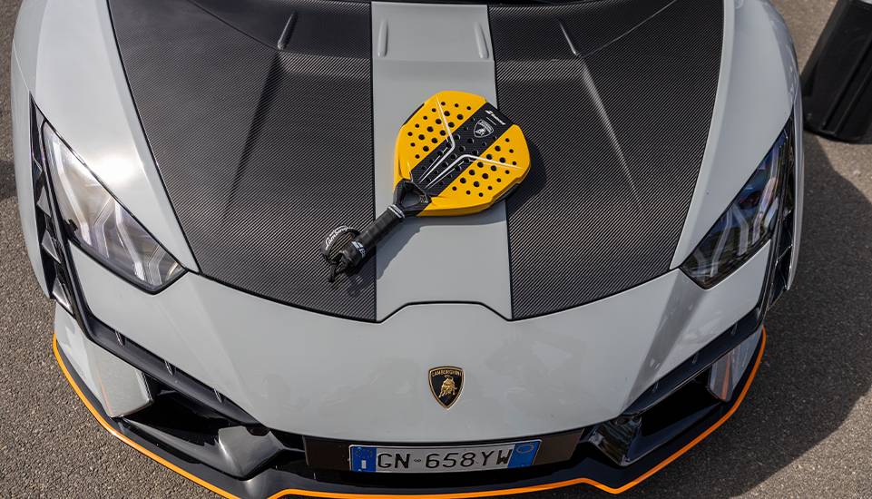 The Babolat x Lamborghini BL002 padel racket featuring carbon fiber finish and Lamborghini's signature aesthetic.