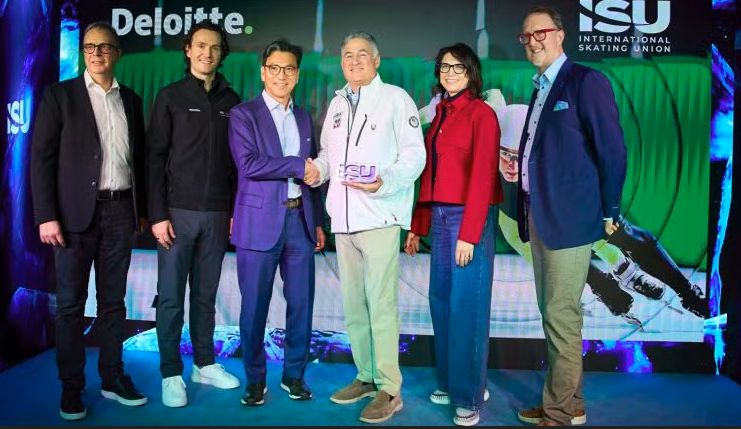 ISU President Jae Youl Kim and Deloitte leaders announcing the partnership at the Home of Skating during the Milano Cortina 2026 Winter Olympics.