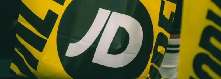 JD Sports storefront with the company logo reflecting the latest financial news of a 200 million pound share buyback.