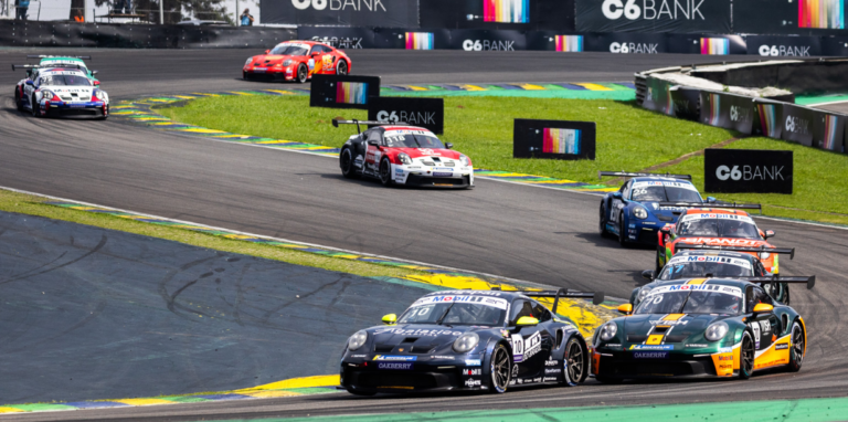 Porsche 911 GT3 Cup cars racing at Interlagos with C6 Bank and Estrella Galicia logos.