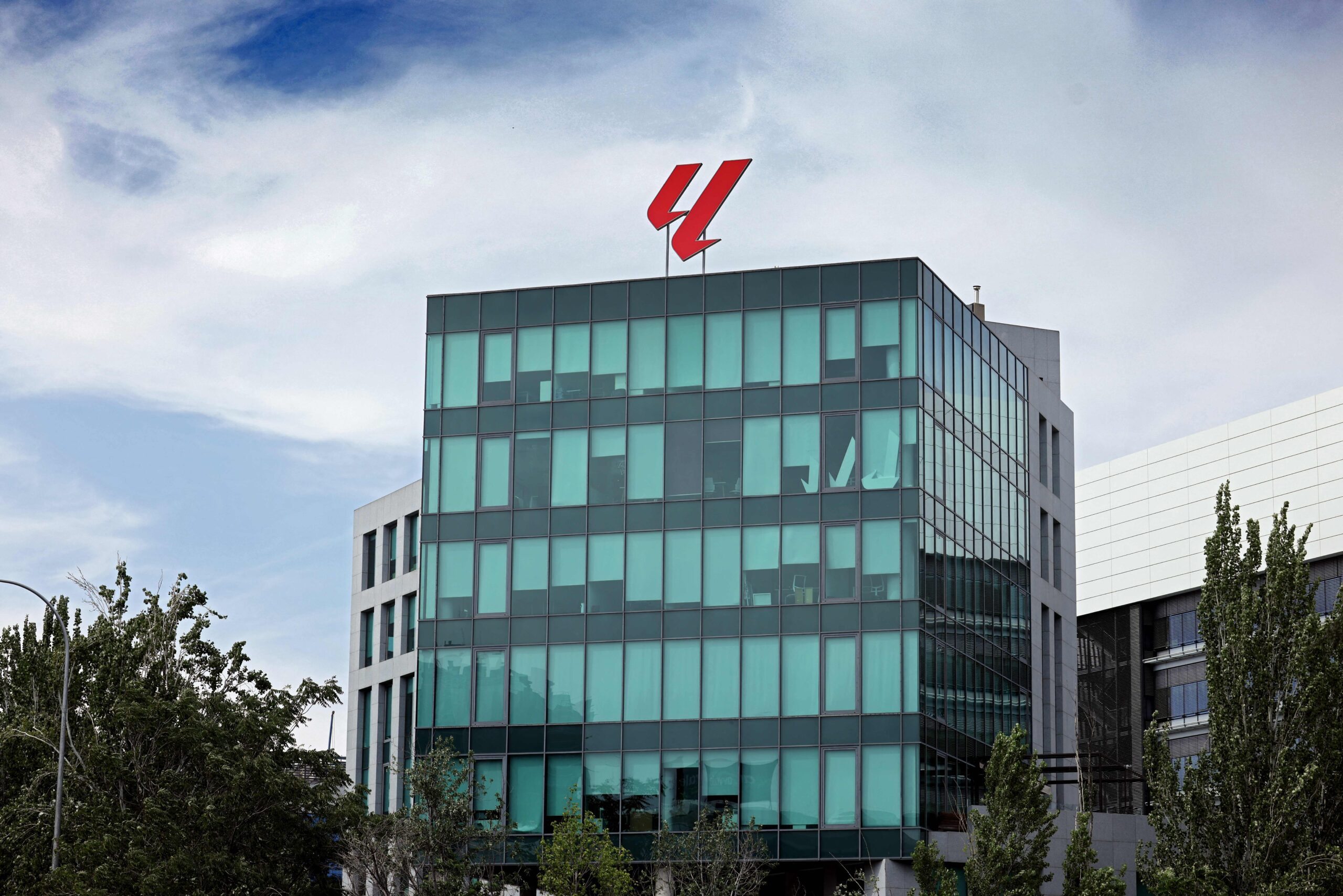 The corporate headquarters of LaLiga, the Spanish football league, a modern glass building with the official logo.
